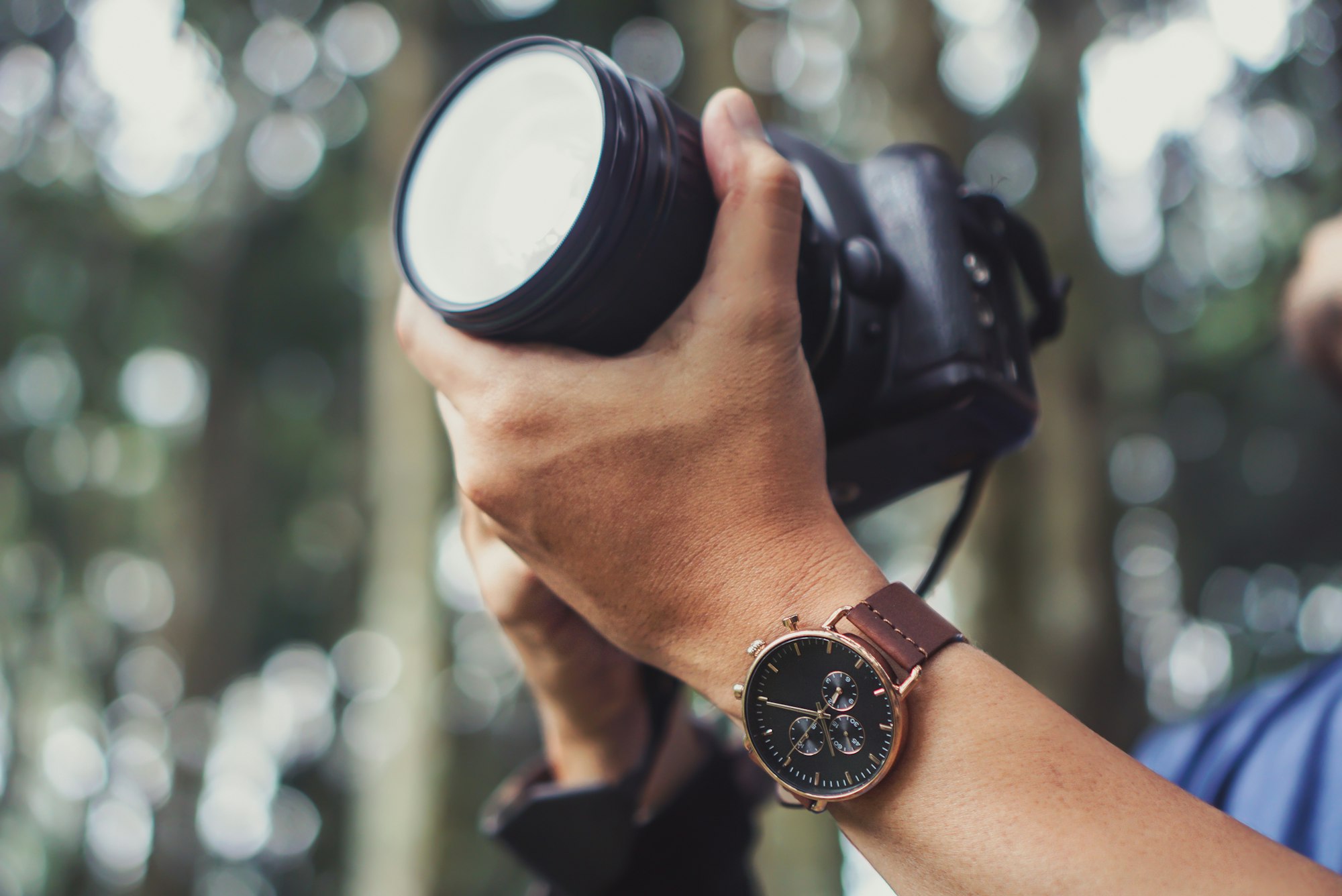 Photographer hands using DSLR Camera