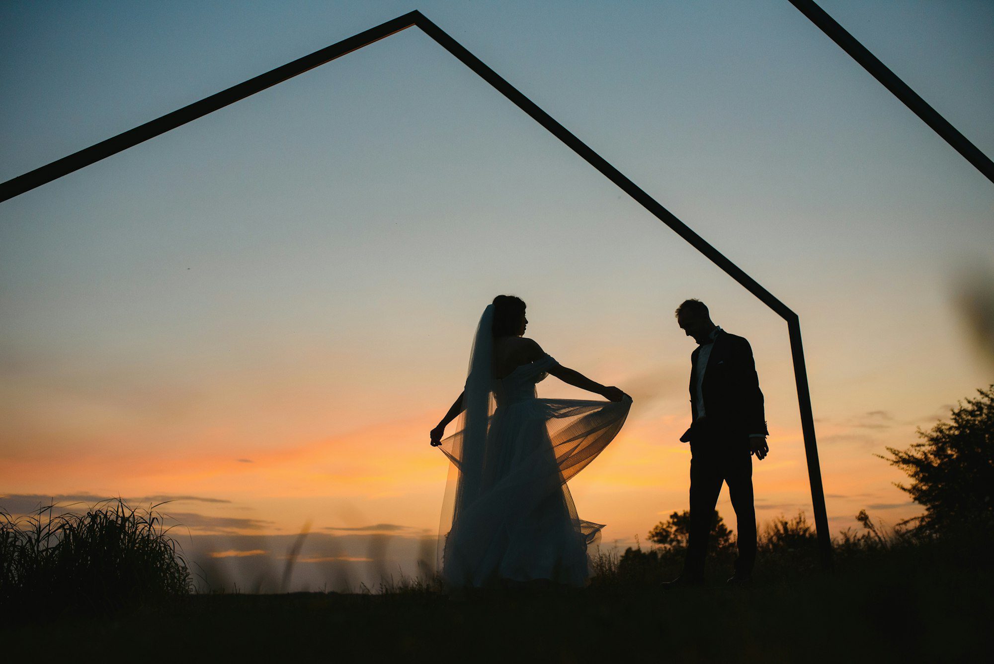 wedding couple with the sunset.